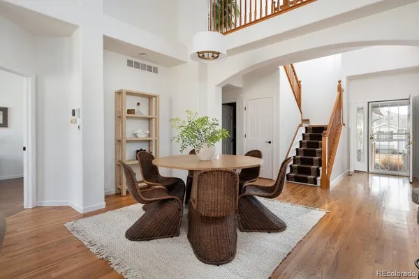 a view of a livingroom with furniture and wooden floor
