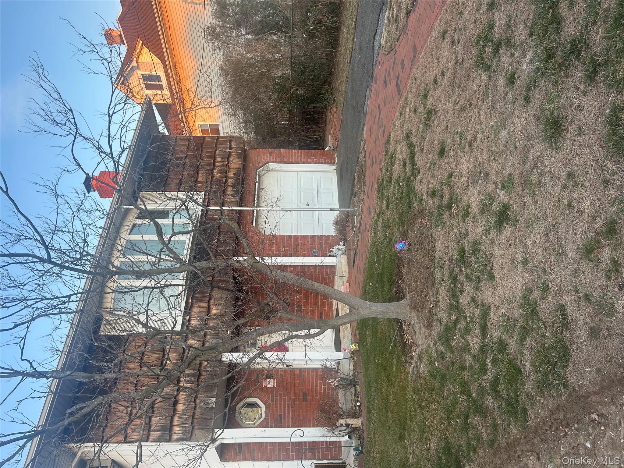 131 Ethel Street Valley Stream, NY 11580 - Photo 2 of 18 a front view of a house with a yard