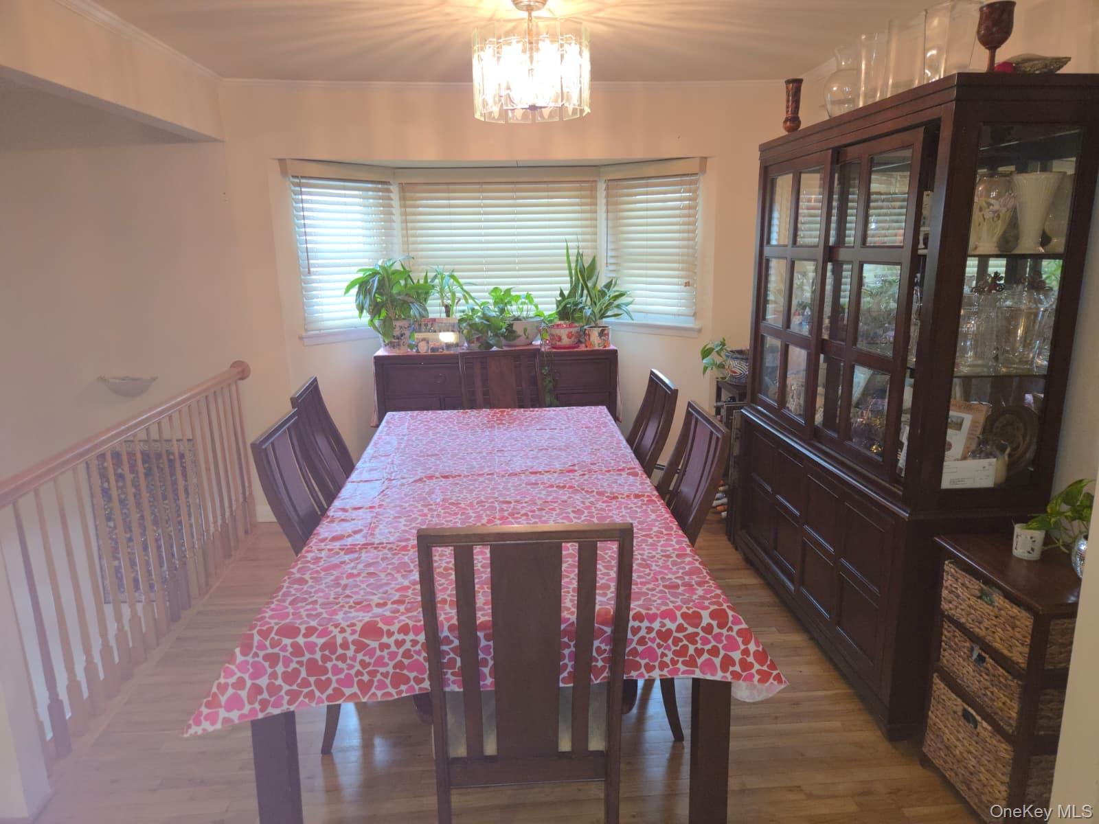 131 Ethel Street Valley Stream, NY 11580 - Photo 10 of 18 a view of a dining room with furniture window and wooden floor