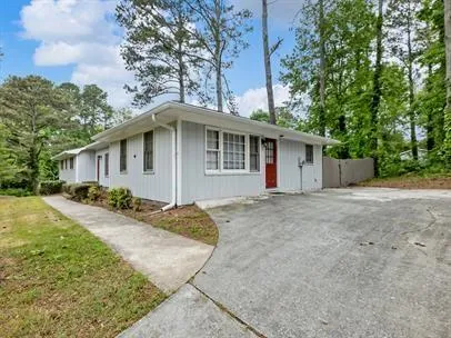 front view of a house with a yard