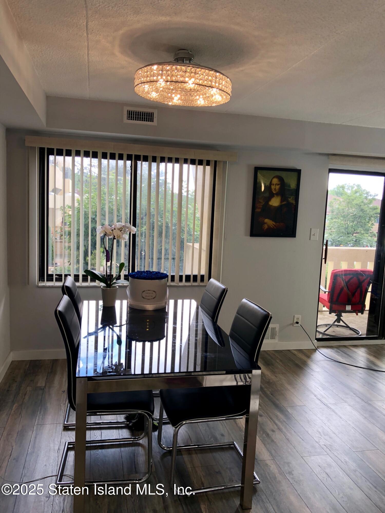 11 Windham Loop, Unit 2DD Staten Island, NY 10314 - Photo 11 of 27 a view of a dining room with furniture window and outside view