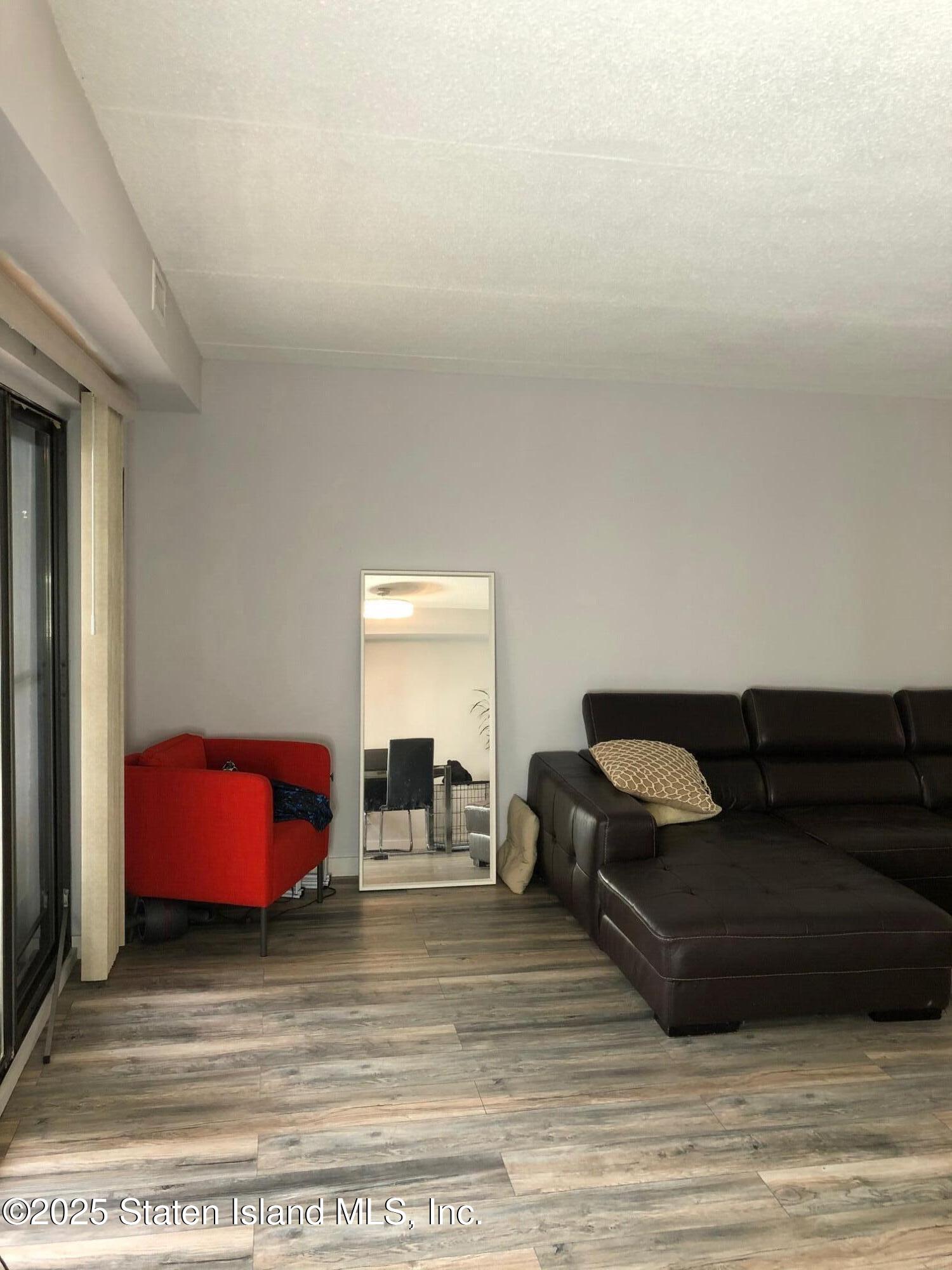 11 Windham Loop, Unit 2DD Staten Island, NY 10314 - Photo 15 of 27 a living room with furniture