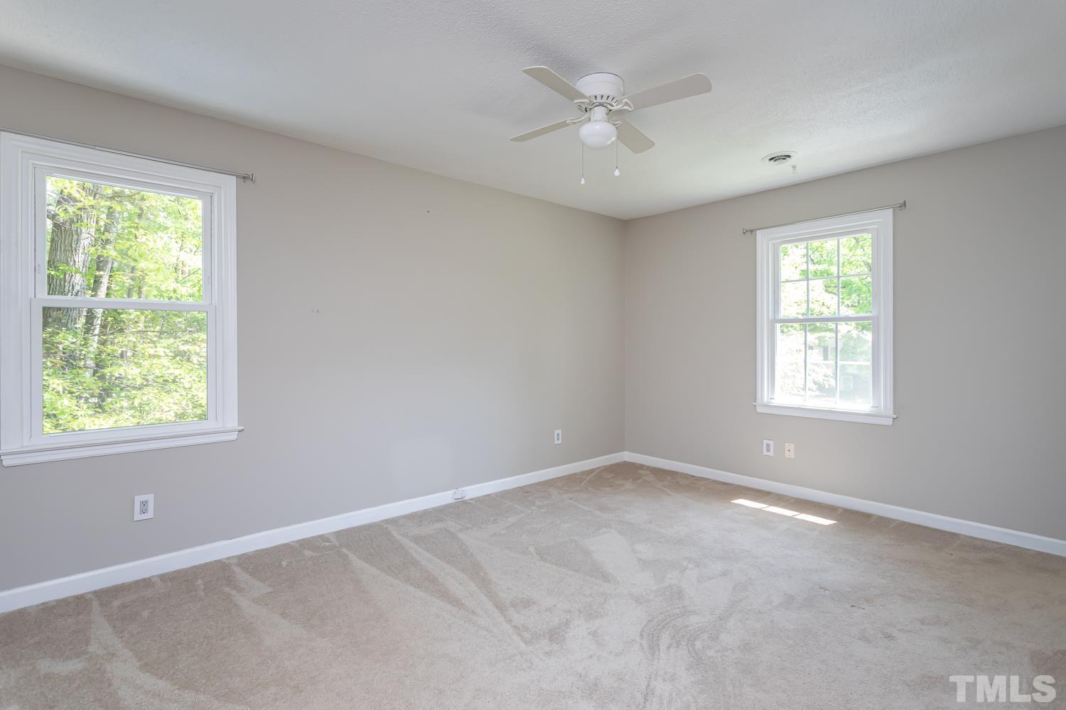 1304 Lake Pine Drive Cary, NC 27511 - Photo 20 of 26 an empty room with windows
