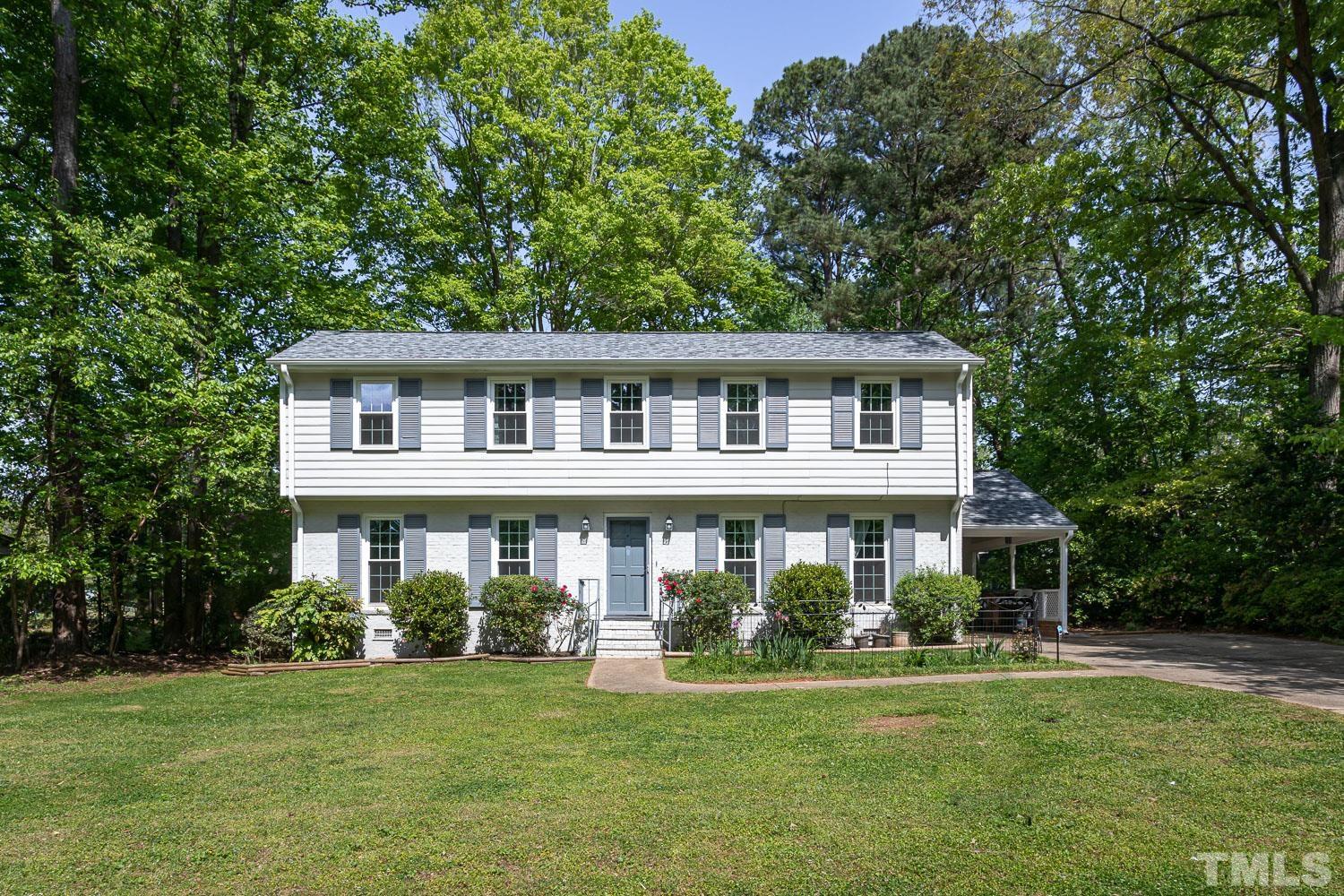 1304 Lake Pine Drive Cary, NC 27511 - Photo 2 of 26 a front view of a house with a garden