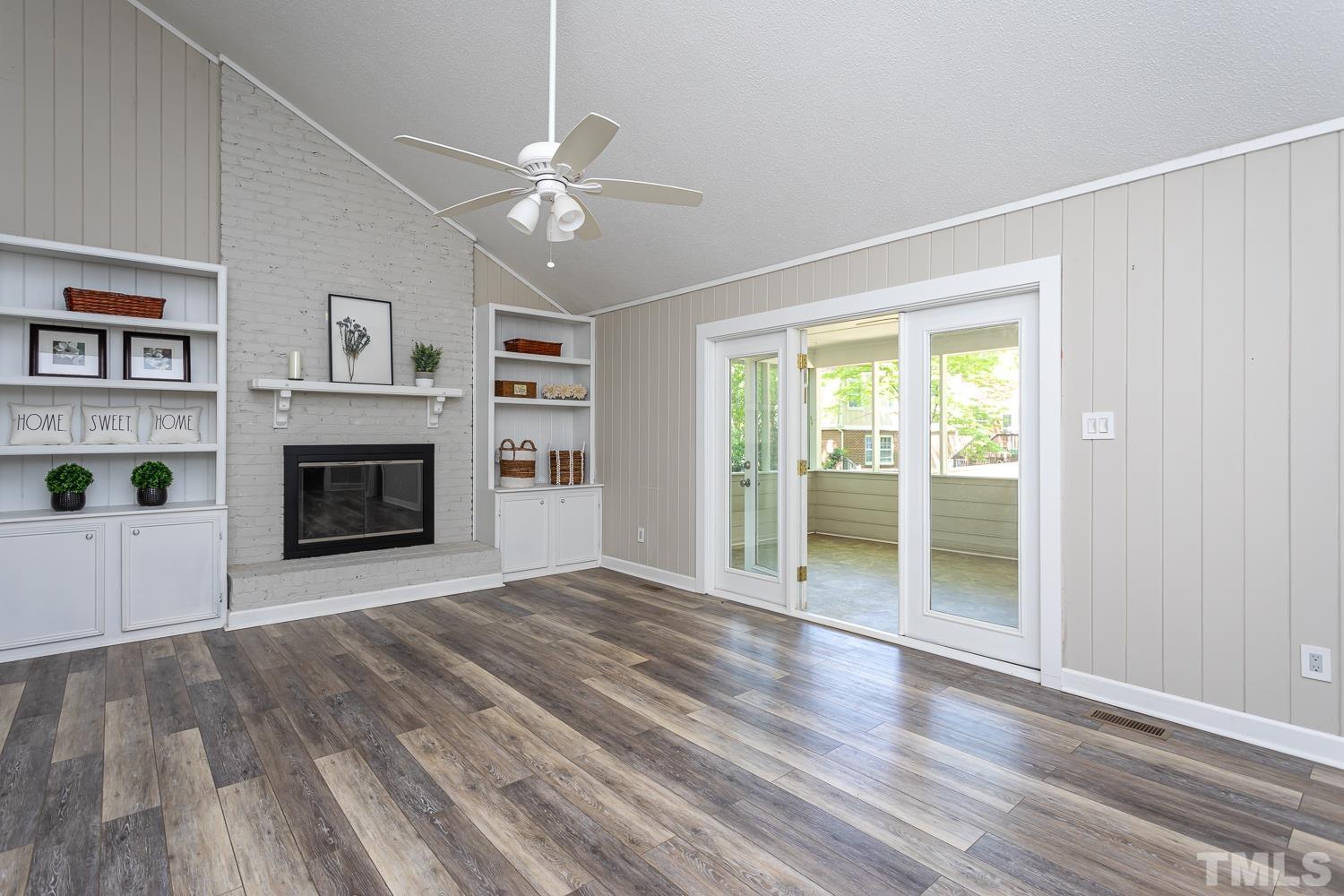 1304 Lake Pine Drive Cary, NC 27511 - Photo 22 of 26 a view of an empty room with a window and fireplace