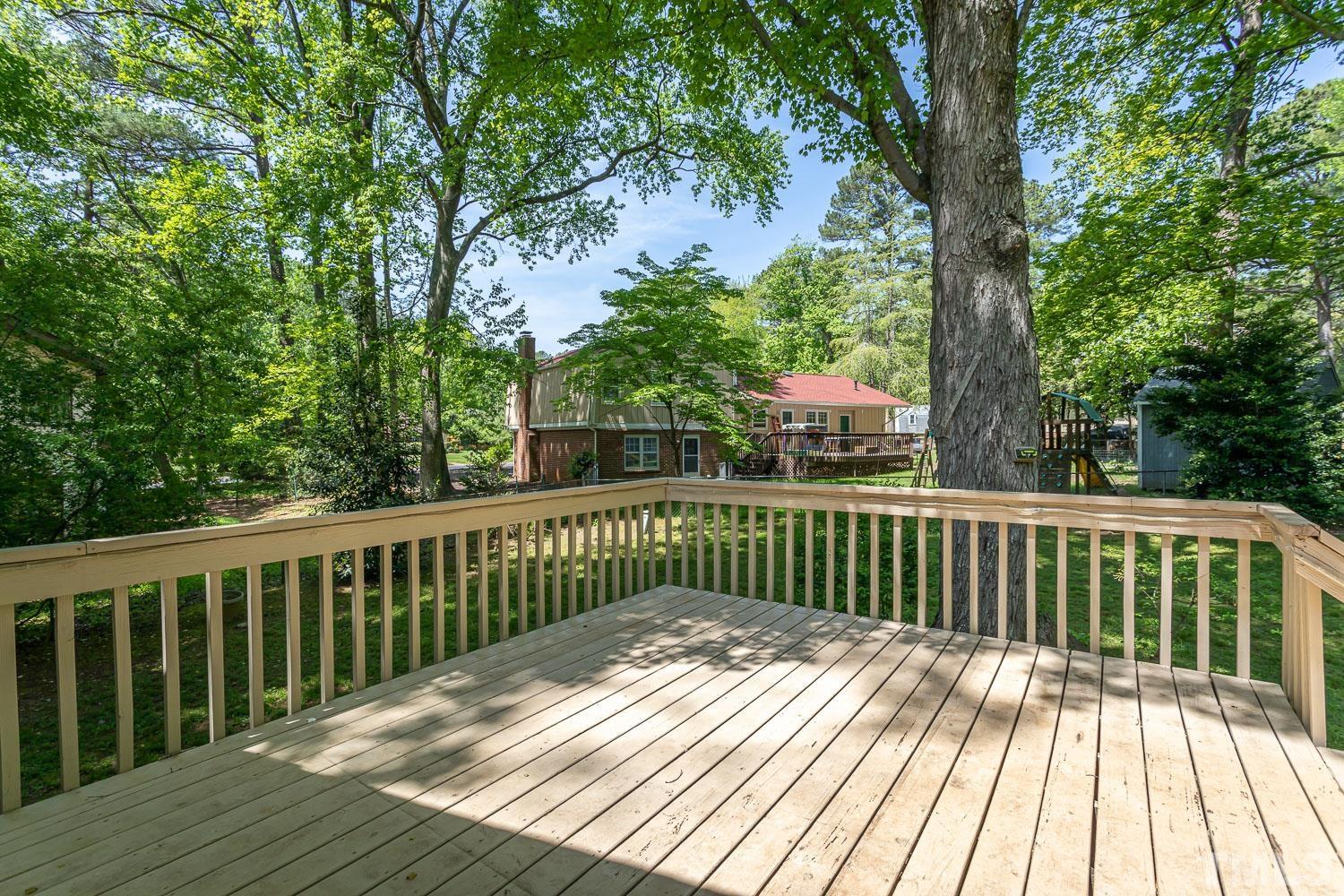 1304 Lake Pine Drive Cary, NC 27511 - Photo 25 of 26 a view of balcony with wooden floor and fence