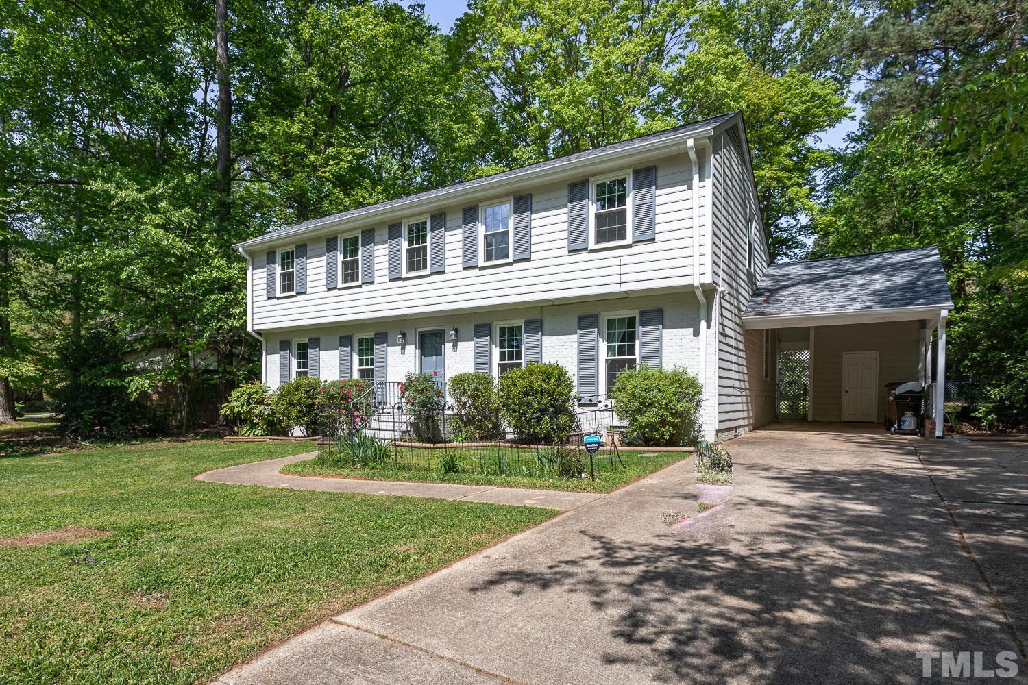1304 Lake Pine Drive Cary, NC 27511 - Photo 3 of 26 a front view of a house with a yard