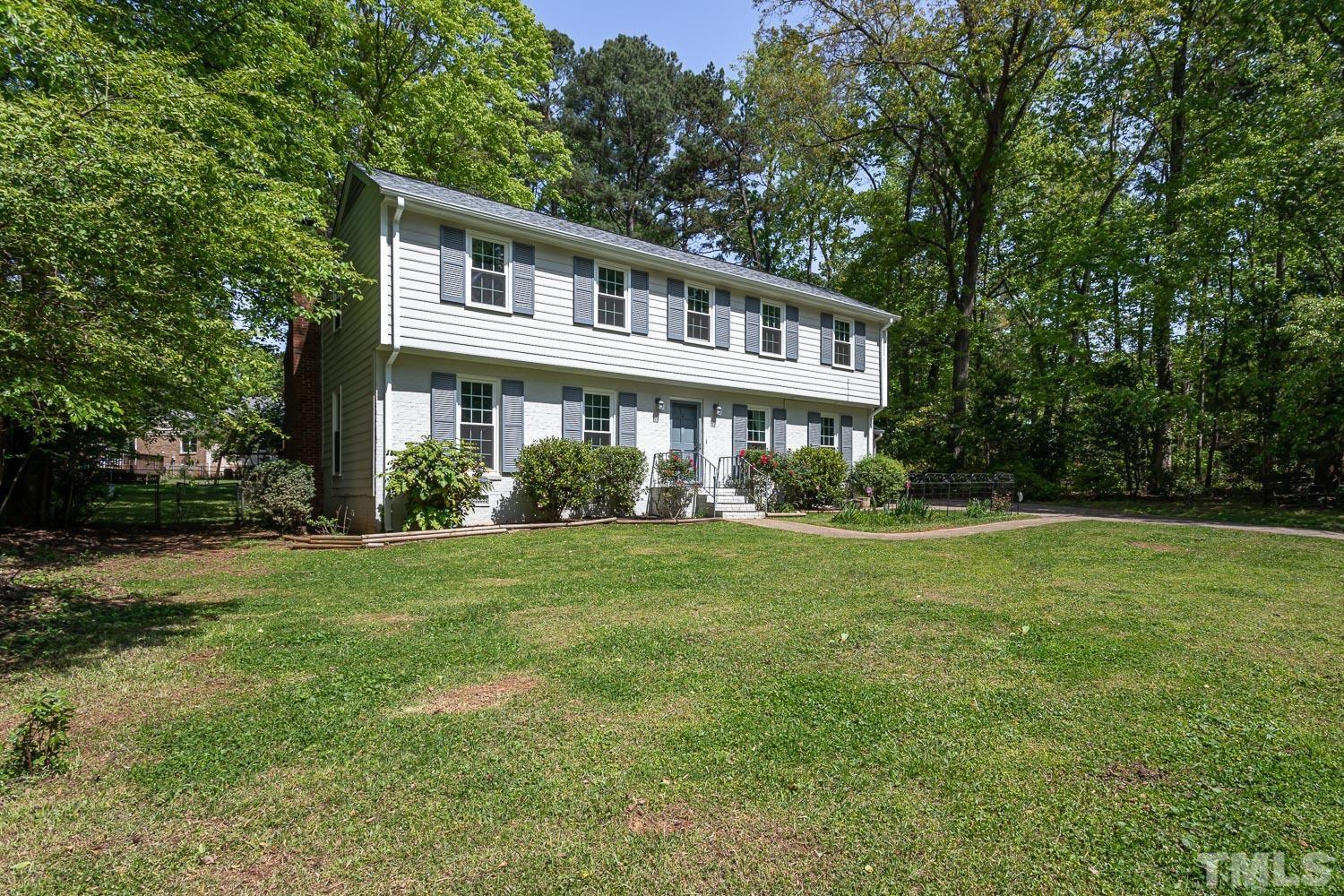 1304 Lake Pine Drive Cary, NC 27511 - Photo 4 of 26 a front view of a house with a yard