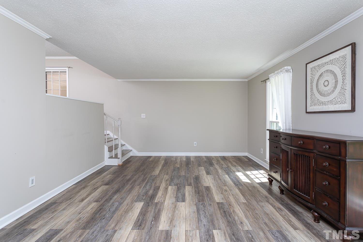 1304 Lake Pine Drive Cary, NC 27511 - Photo 5 of 26 wooden floor in an empty room with a window