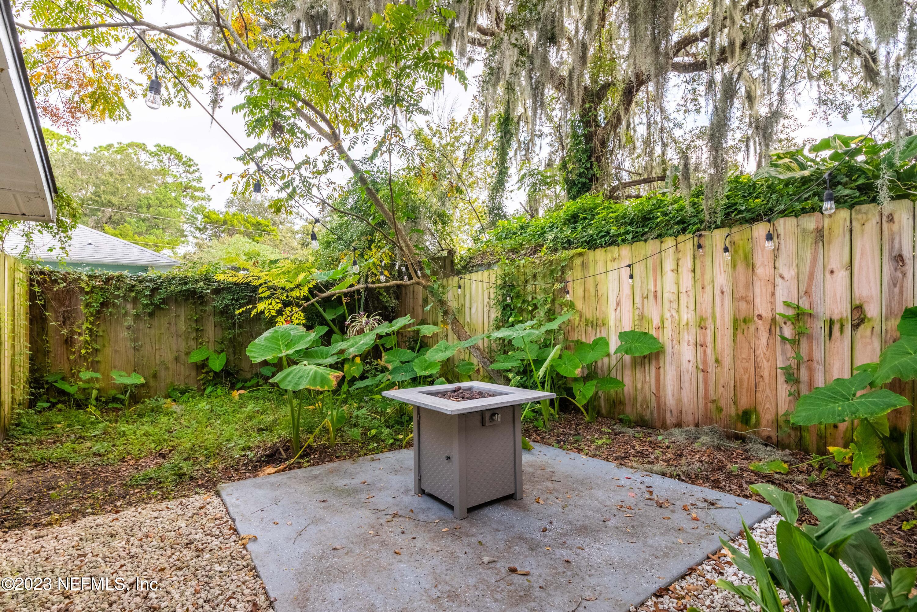 511 Gerona Road St. Augustine, FL 32086 - Photo 24 of 30 a view of a garden filled with lots of plants and trees