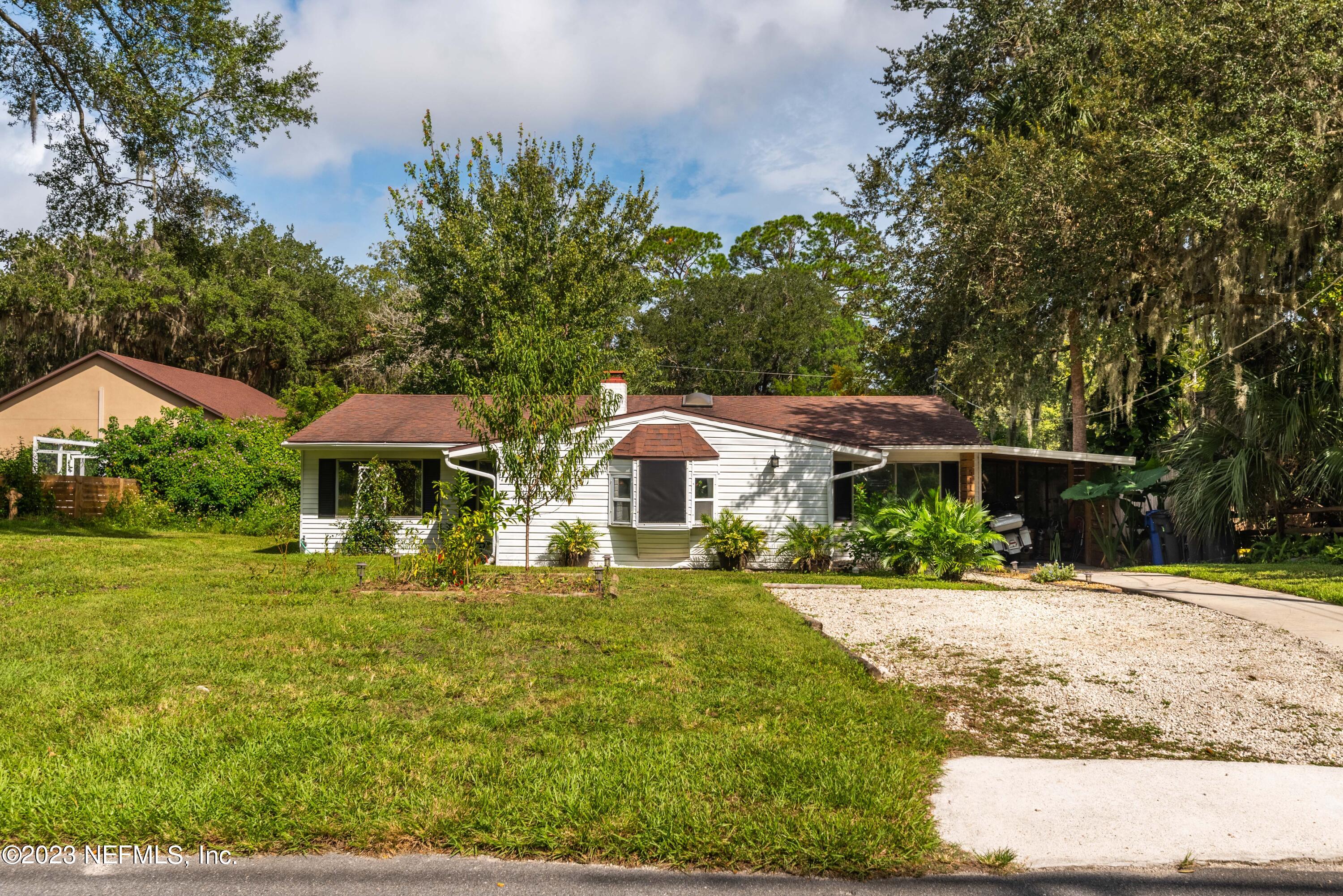 511 Gerona Road St. Augustine, FL 32086 - Photo 30 of 30 a front view of house with yard and trees
