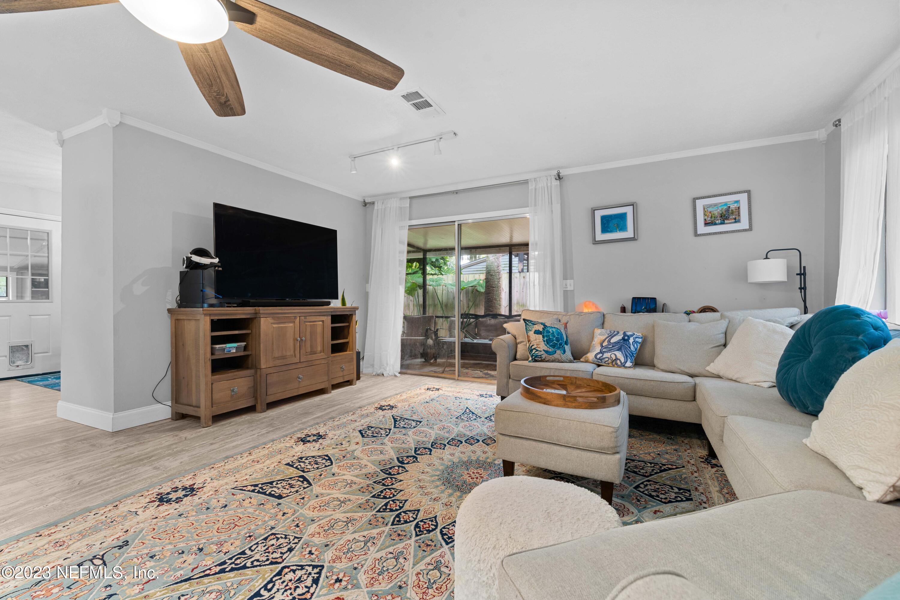 511 Gerona Road St. Augustine, FL 32086 - Photo 5 of 30 a living room with furniture and a flat screen tv