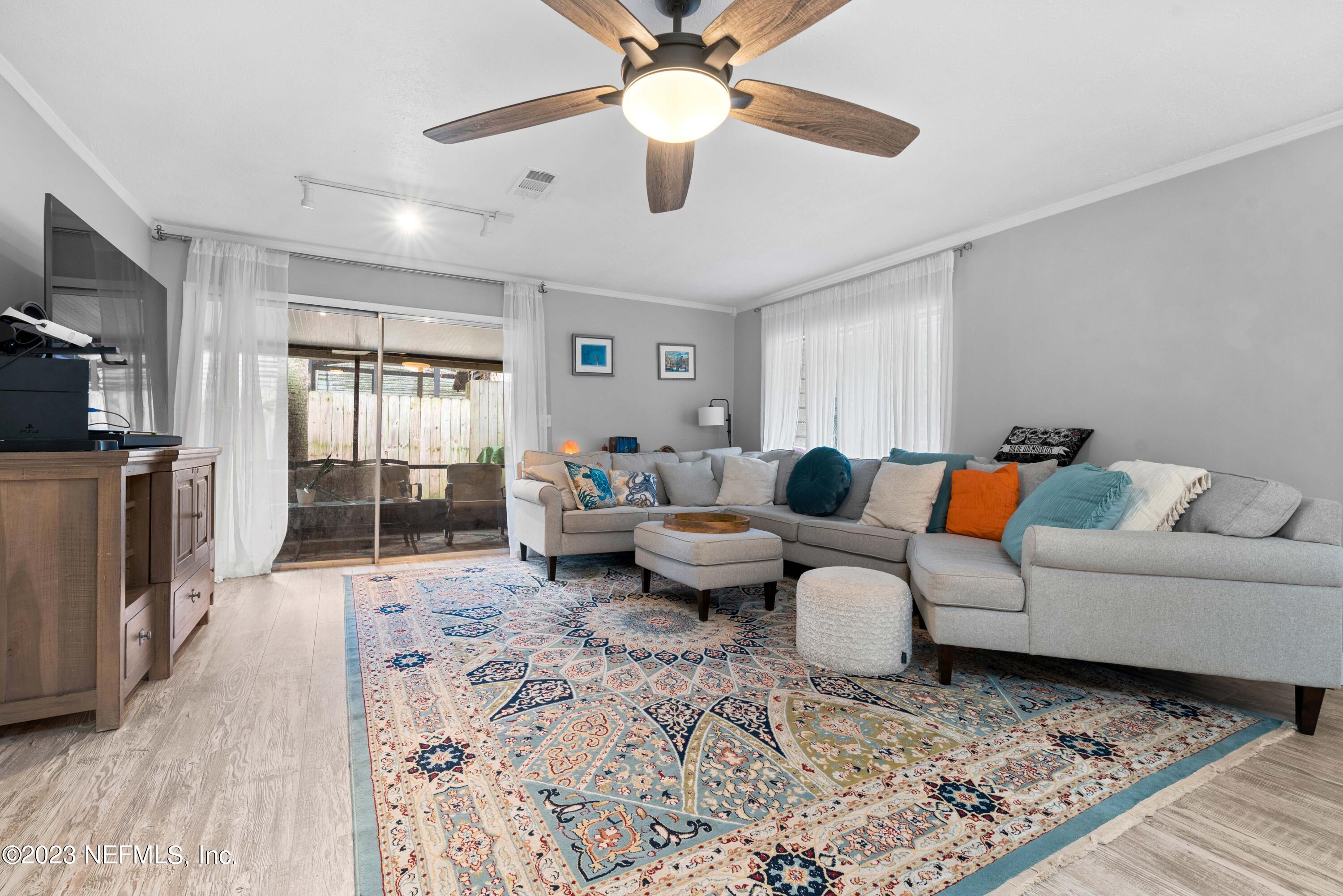 511 Gerona Road St. Augustine, FL 32086 - Photo 8 of 30 a living room with furniture and a rug