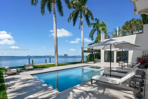 a kitchen with stainless steel appliances kitchen island granite countertop a sink and cabinets