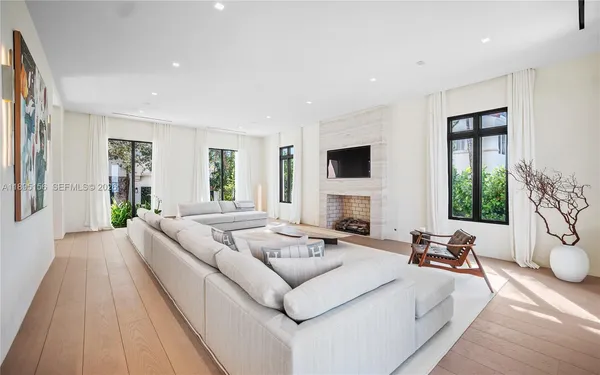 a kitchen with kitchen island a sink appliances and cabinets