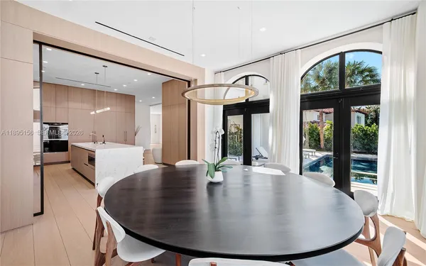 a bedroom with a large bed and a flat screen tv