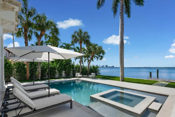 a bedroom with a bed and a night stand