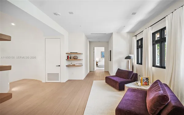 an aerial view of a house with a lake view