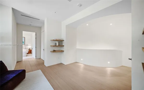 a front view of a house with plants