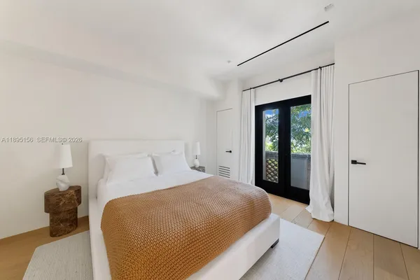 a front view of residential houses with outdoor space and garden