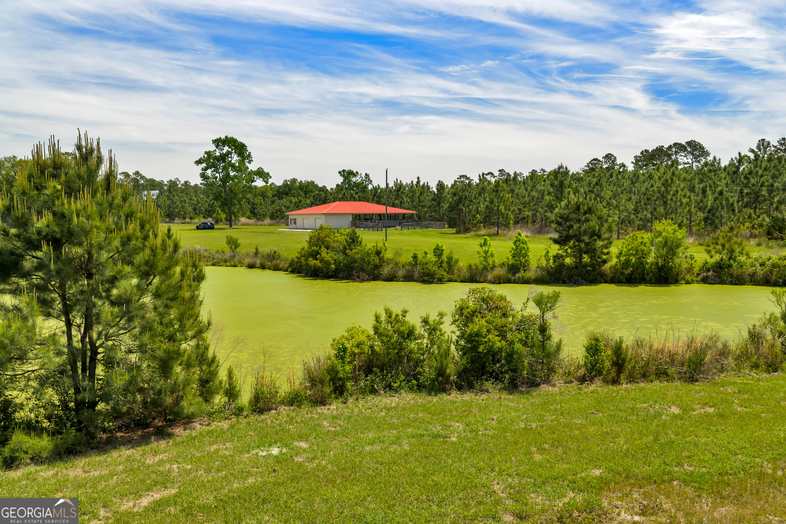 3807 Val Tech Road Valdosta, GA 31602 - Photo 18 of 39 a view of a lake with a yard