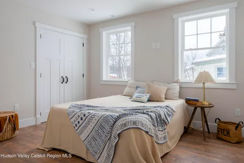 a bedroom with a bed and window