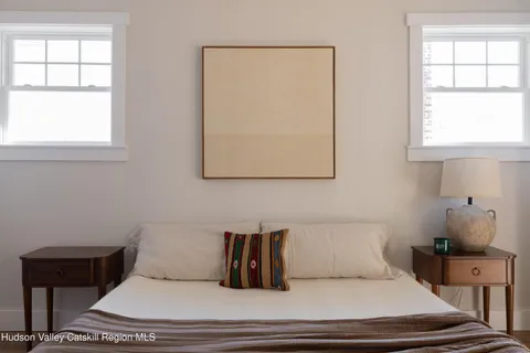 a kitchen with stainless steel appliances granite countertop a stove a sink dishwasher a dining table and chairs with wooden floor