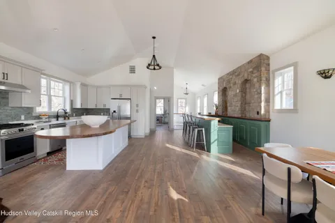 a dining room with furniture and window