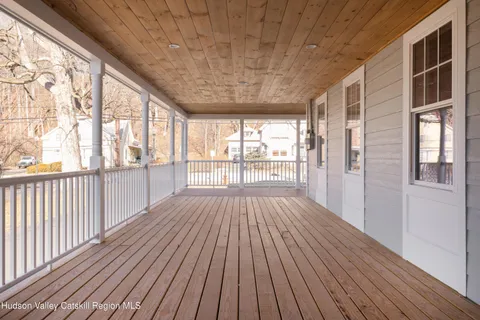 a view of an entryway with wooden floor and stairs