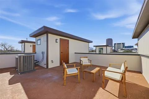 a view of a chairs and table in a patio