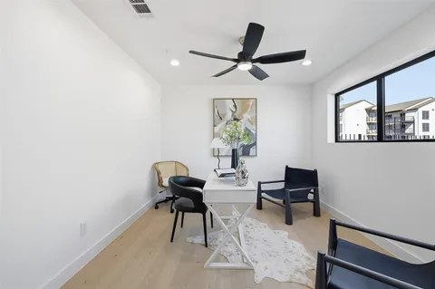 a workspace with furniture and window