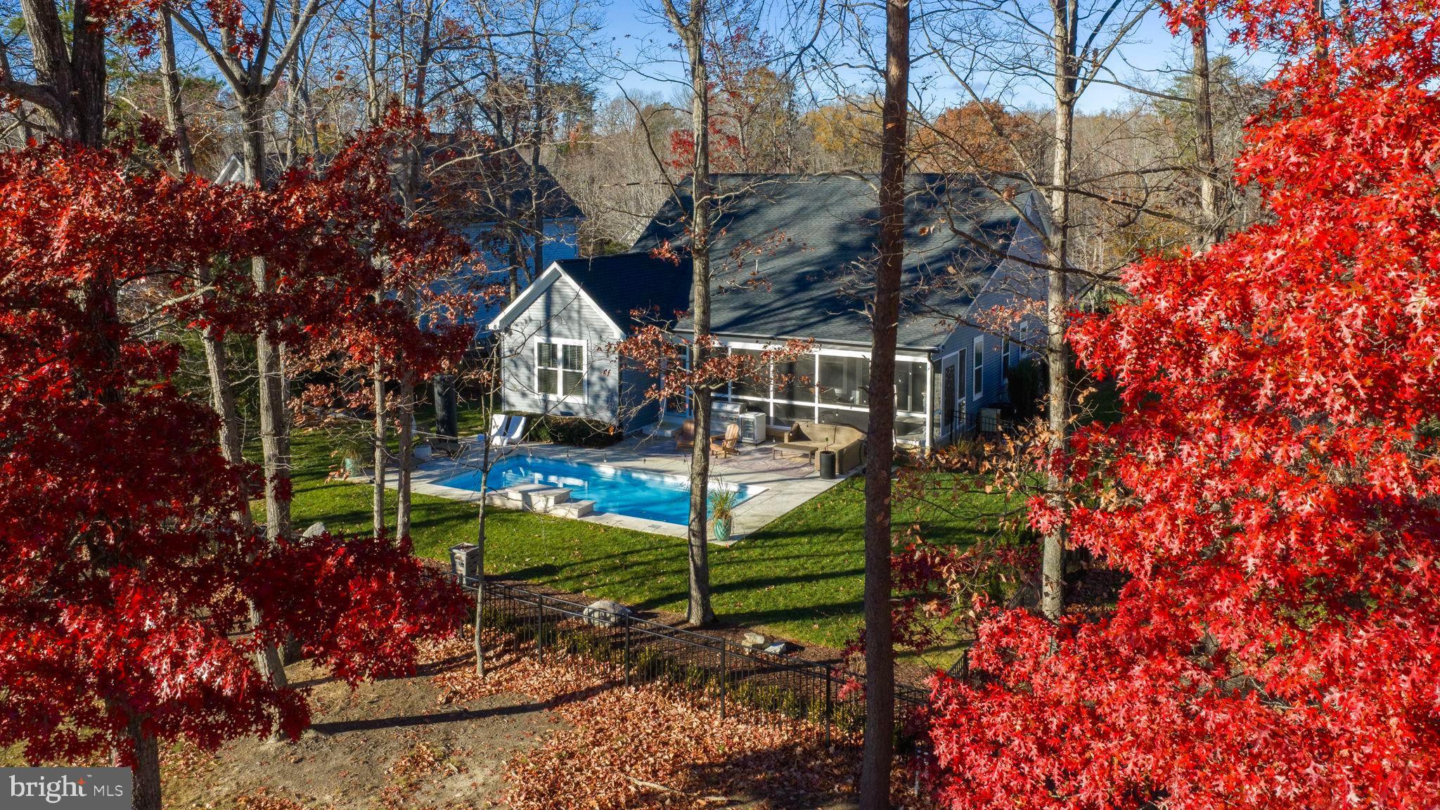 10908 Chatham Ridge Way Spotsylvania, VA 22551 - Photo 2 of 47 a view of outdoor space and blue swimming pool