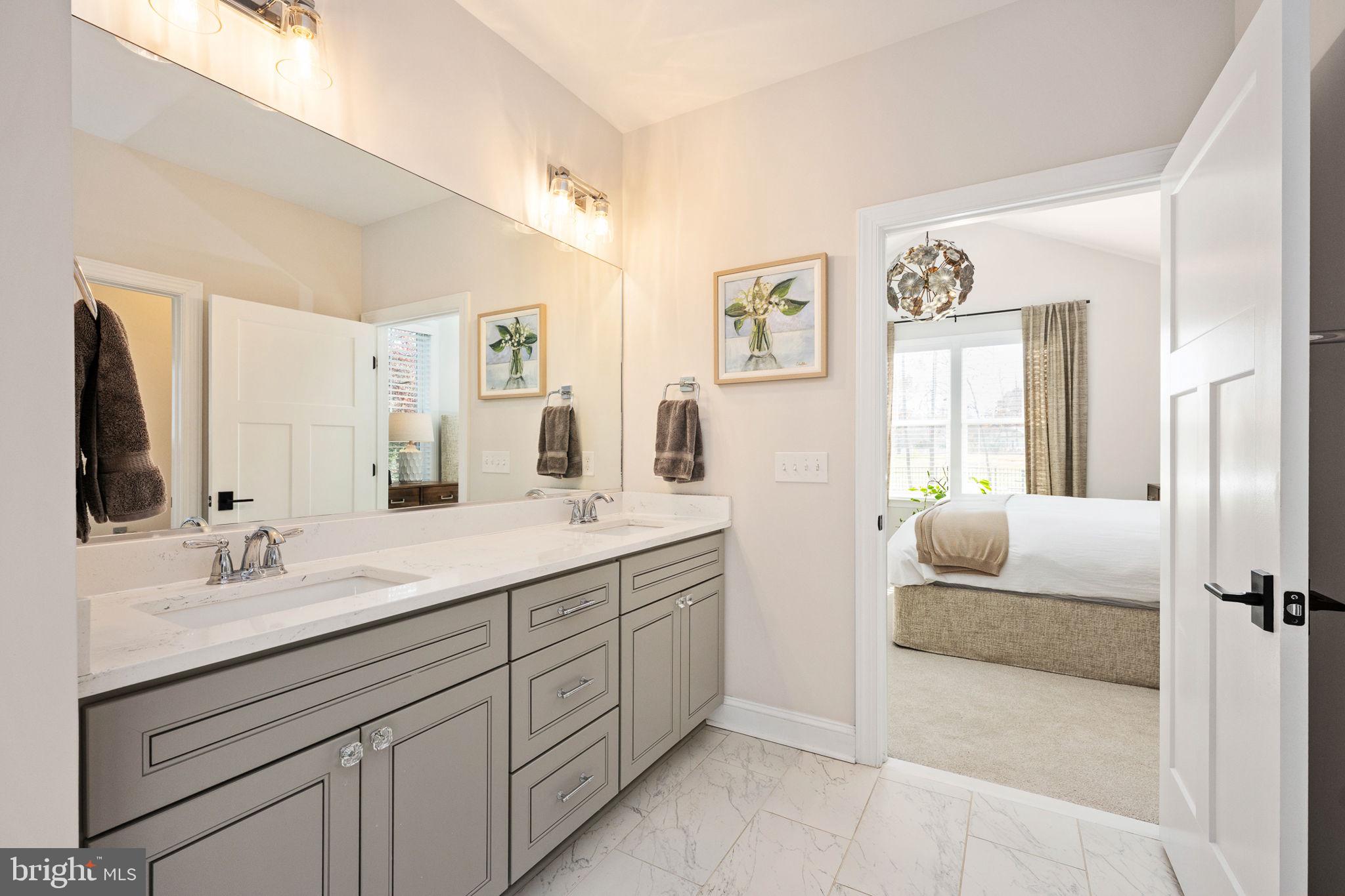 10908 Chatham Ridge Way Spotsylvania, VA 22551 - Photo 22 of 47 a en suite bathroom with double sink and a mirror