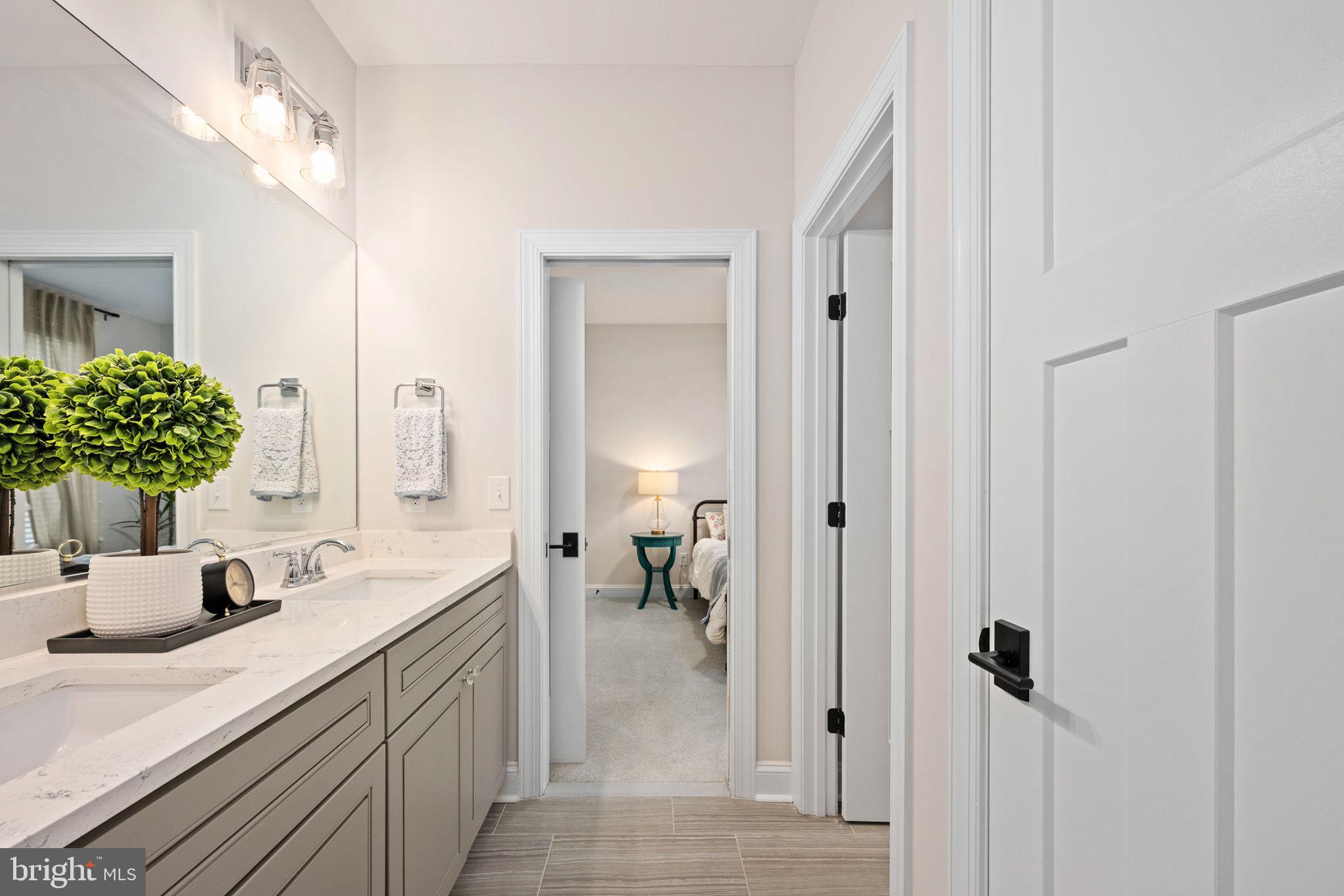 10908 Chatham Ridge Way Spotsylvania, VA 22551 - Photo 25 of 47 a bathroom with a sink and a mirror