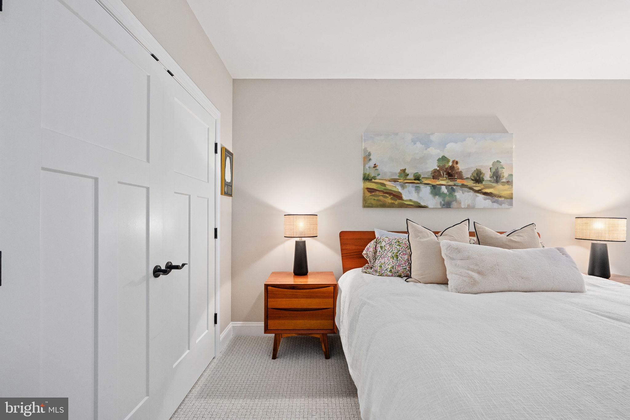 10908 Chatham Ridge Way Spotsylvania, VA 22551 - Photo 30 of 47 a bedroom with a bed and a lamp