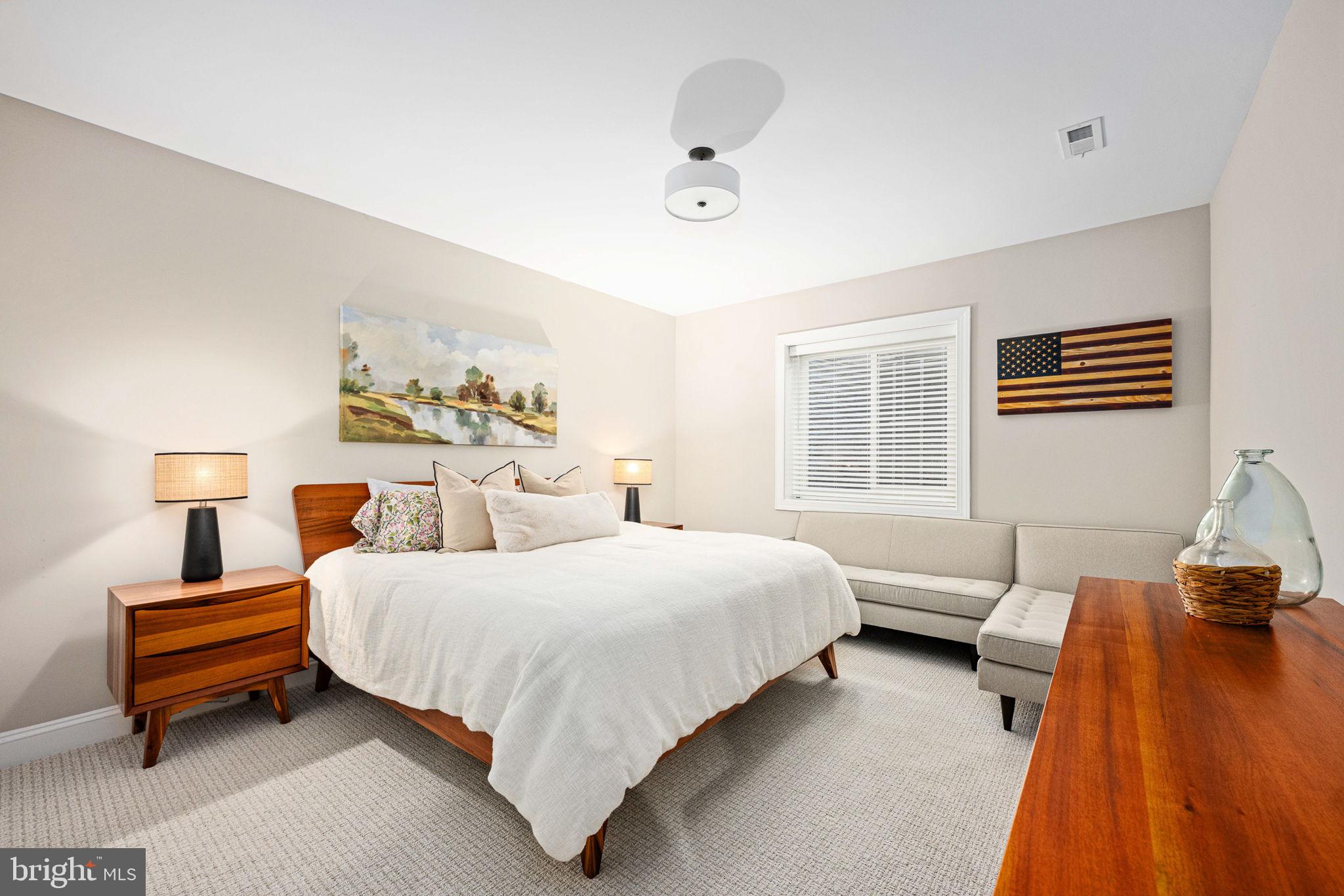 10908 Chatham Ridge Way Spotsylvania, VA 22551 - Photo 31 of 47 a bedroom with a bed and wooden floor