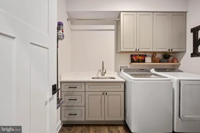 a view of cabinets with washer dryer