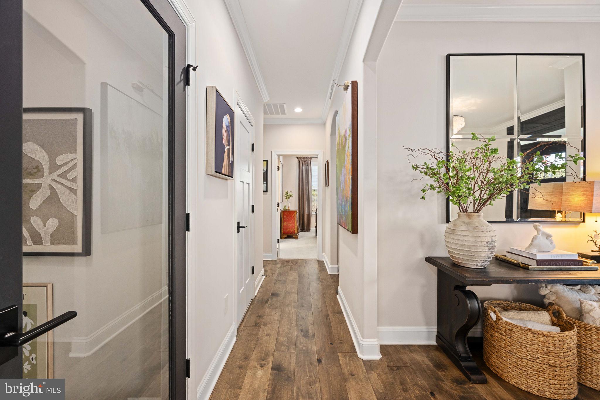10908 Chatham Ridge Way Spotsylvania, VA 22551 - Photo 5 of 47 a view of a hallway with furniture and wooden floor