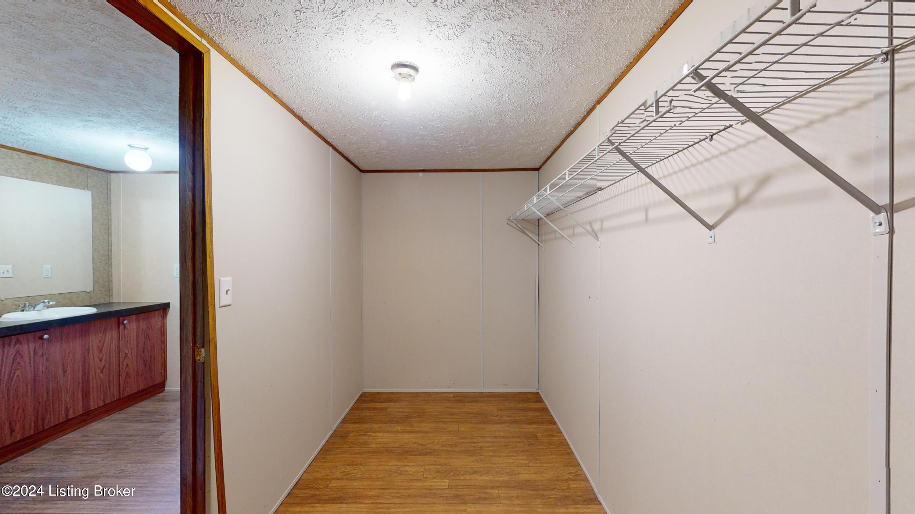 686 Windy Ridge Road Bedford, KY 40006 - Photo 12 of 42 walk in closet in the primary bedroom