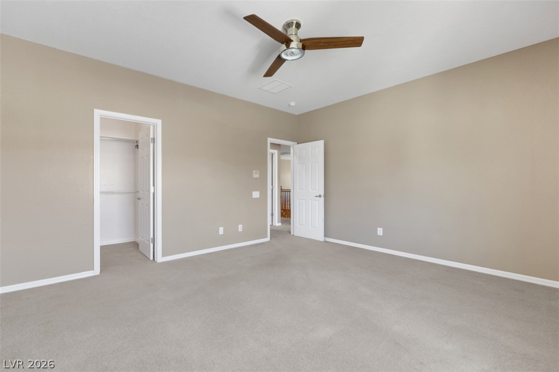 2501 Bechamel Place Henderson, NV 89044 - Photo 35 of 50 A quiet retreat with comfortable carpeting and a convenient walk-in closet for ample storage.