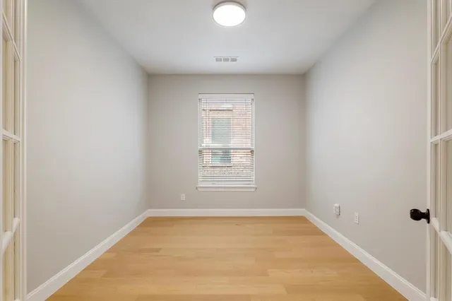 a kitchen with stainless steel appliances kitchen island a refrigerator sink and microwave