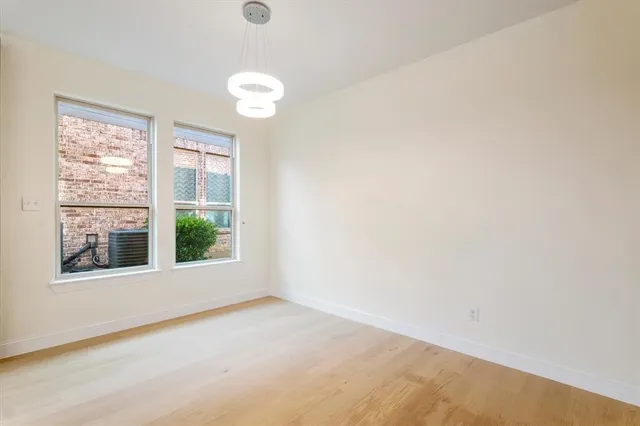 a kitchen with stainless steel appliances kitchen island granite countertop a stove and a sink