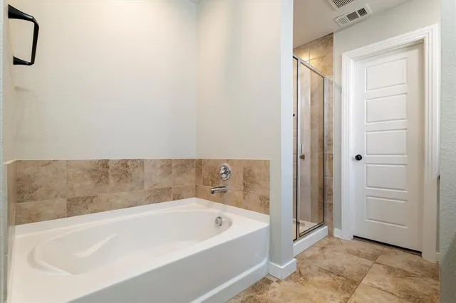 a bathroom with a double vanity sink a mirror and shower