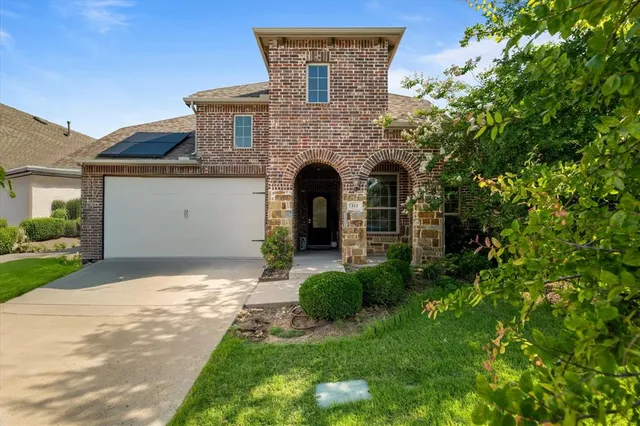 a view of swimming pool with a garden and patio