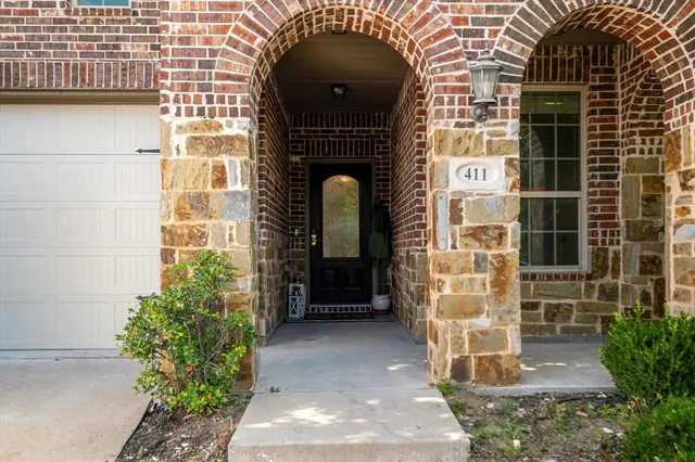 an outdoor sitting area with an umbrella
