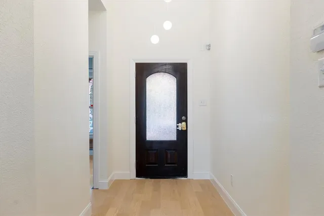 a view of a room that has a mirror in it