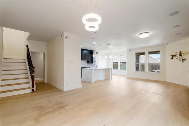 a view of a kitchen with a sink cabinets and a fireplace
