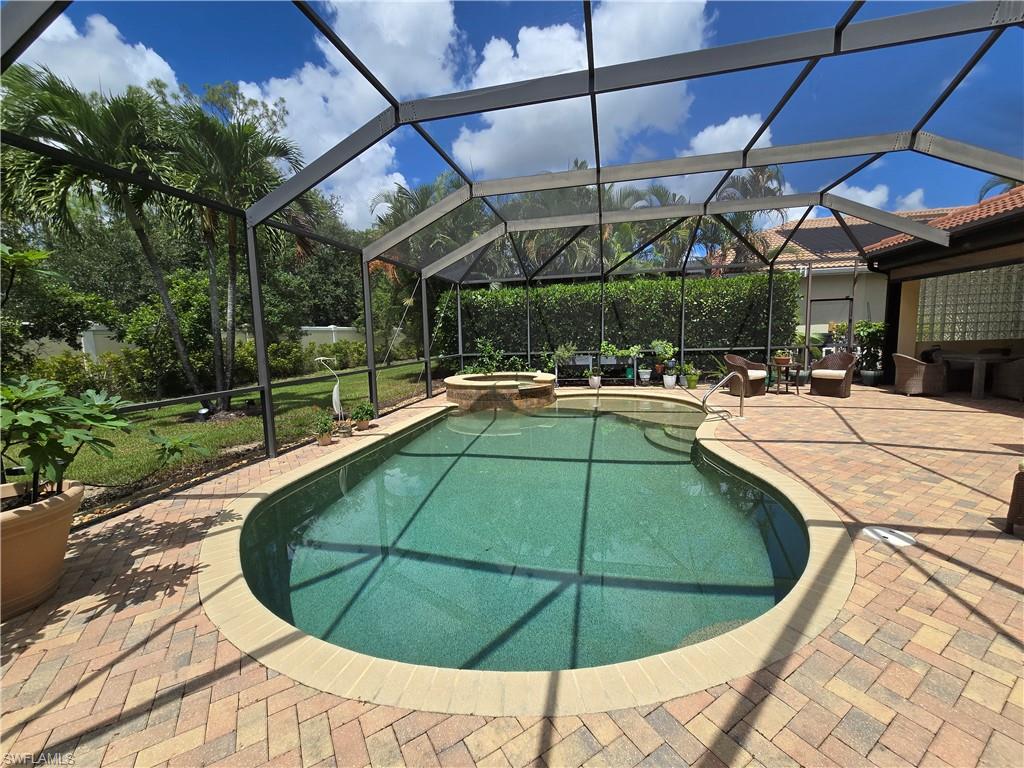 7887 Martino Circle Naples, FL 34112 - Photo 16 of 25 a view of outdoor space with swimming pool
