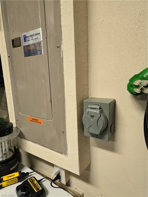7887 Martino Circle Naples, FL 34112 - Photo 18 of 25 a bathroom with a sink and a mirror