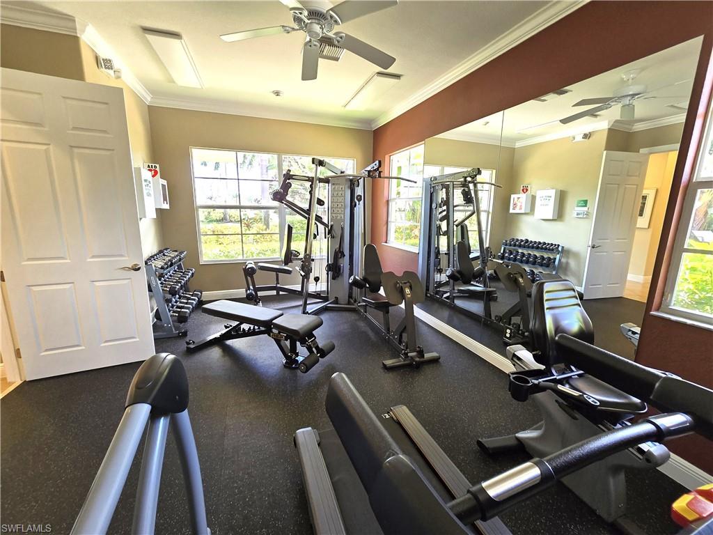 7887 Martino Circle Naples, FL 34112 - Photo 21 of 25 a view of a room with gym equipment